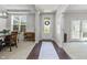 Bright foyer with hardwood floors, white trim, and views to other rooms at 2798 W High Grove Cir, Zionsville, IN 46077