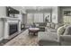 Inviting living room featuring a cozy fireplace and plush sectional sofa at 2798 W High Grove Cir, Zionsville, IN 46077