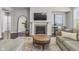 Cozy living room features fireplace, large TV, decorative mirror, and comfortable seating on a stylish rug at 2798 W High Grove Cir, Zionsville, IN 46077