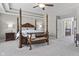 This spacious main bedroom features tray ceilings, a four-post bed, and an ensuite bathroom at 2798 W High Grove Cir, Zionsville, IN 46077