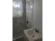 Bathroom featuring tub and shower combination with stylish marble tile and white sink at 2801 Brouse Ave, Indianapolis, IN 46218