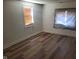 This bedroom features wood floors and a window for natural light at 2801 Brouse Ave, Indianapolis, IN 46218