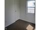 This bedroom features gray carpet, a window for natural light, and a standard closet at 2801 Brouse Ave, Indianapolis, IN 46218