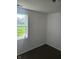 An empty bedroom featuring neutral walls, carpet and a window with view of the outdoors at 2801 Brouse Ave, Indianapolis, IN 46218