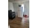 A kitchen with essential appliances, including a black oven and a white refrigerator, on wood-look flooring at 2801 Brouse Ave, Indianapolis, IN 46218