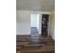 The open living area features modern wood flooring and leads to additional rooms for flexible living at 2801 Brouse Ave, Indianapolis, IN 46218