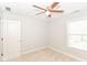 Bedroom with a ceiling fan, plush carpet, and natural light at 2945 N New Jersey St, Indianapolis, IN 46205
