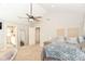 Comfortable bedroom featuring a ceiling fan, plush carpet, and natural light at 2945 N New Jersey St, Indianapolis, IN 46205
