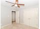 Neutral bedroom with ceiling fan, carpeted floors, closet and access to another room at 2945 N New Jersey St, Indianapolis, IN 46205
