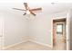 Neutral bedroom featuring a ceiling fan and carpeted floors and entryway to another room at 2945 N New Jersey St, Indianapolis, IN 46205