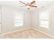 Neutral bedroom featuring two windows with blinds, ceiling fan, and carpeted floors at 2945 N New Jersey St, Indianapolis, IN 46205