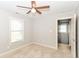 Neutral bedroom with one window, ceiling fan, carpeted floors and doorway at 2945 N New Jersey St, Indianapolis, IN 46205