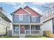 Charming two-story home features a welcoming front porch and a beautifully painted exterior at 2945 N New Jersey St, Indianapolis, IN 46205