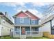 Charming two-story home features a welcoming front porch and a beautifully painted exterior at 2945 N New Jersey St, Indianapolis, IN 46205