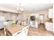 Open concept kitchen with granite counters, an island with seating, and hardwood floors at 2945 N New Jersey St, Indianapolis, IN 46205