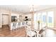 Open concept kitchen with granite counters, an island with seating, and lots of natural light at 2945 N New Jersey St, Indianapolis, IN 46205