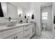 Well-lit bathroom with double vessel sinks and vanity offering a modern aesthetic at 3133 Ruckle St, Indianapolis, IN 46205