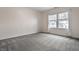 Bright bedroom with ample light from large windows and a calming neutral color palette at 3133 Ruckle St, Indianapolis, IN 46205