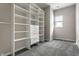 Walk-in closet featuring custom shelving, ample space for organization, and natural lighting at 3133 Ruckle St, Indianapolis, IN 46205