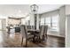 Elegant dining room with stylish light fixture and a window seat that provides natural light at 3133 Ruckle St, Indianapolis, IN 46205