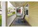 Relax on this covered porch with chairs, string lights, and a charming outdoor ambiance at 3133 Ruckle St, Indianapolis, IN 46205