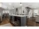 Spacious open floor plan kitchen with a large island, stainless appliances, and easy access to the dining area at 3133 Ruckle St, Indianapolis, IN 46205