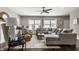 Spacious living room features a comfortable sectional sofa and multiple windows for natural light at 3133 Ruckle St, Indianapolis, IN 46205