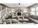 Cozy living room with a fireplace, large windows, and comfortable seating at 3133 Ruckle St, Indianapolis, IN 46205