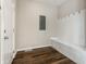 Mud room with wood floors, built-in bench, and coat hooks, perfect for organization at 3133 Ruckle St, Indianapolis, IN 46205