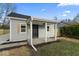 Gray home with a covered front porch, natural wood shutters, and well-maintained landscaping at 338 S Roena St, Indianapolis, IN 46241