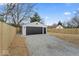 Detached garage provides ample parking and storage space, located behind a fenced yard at 338 S Roena St, Indianapolis, IN 46241