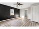 Modern living room with sleek floors, an accent wall, and plenty of natural light at 338 S Roena St, Indianapolis, IN 46241