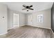 Bright, open living room with new floors, fresh paint, and an updated ceiling fan at 338 S Roena St, Indianapolis, IN 46241