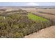 This scenic aerial view highlights the property's expansive land and tranquil rural location at 3718 S County Road 101 E, Clayton, IN 46118