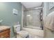 Bathroom with a shower-tub combo featuring a glass enclosure, and a neutral-colored vanity with granite countertop at 3718 S County Road 101 E, Clayton, IN 46118