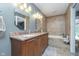 The bathroom is a large size, and includes a bathtub, tiled walls, and a double vanity with granite countertop at 3718 S County Road 101 E, Clayton, IN 46118