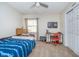 Bright bedroom featuring a single bed, desk, and a ceiling fan for a comfortable living space at 3718 S County Road 101 E, Clayton, IN 46118