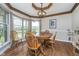 Charming dining room featuring hardwood floors, a bay window, and decorative ceiling trim at 3718 S County Road 101 E, Clayton, IN 46118