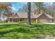 Beautiful brick home with mature landscaping and attached two car garage on a sunny day at 3718 S County Road 101 E, Clayton, IN 46118