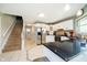 Bright kitchen with white cabinetry, stainless steel appliances, and a black countertop island at 3718 S County Road 101 E, Clayton, IN 46118