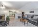 Open living room with neutral carpet, comfortable seating, and a spacious layout at 3718 S County Road 101 E, Clayton, IN 46118