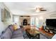 Inviting living room with a brick fireplace and wood-burning stove, perfect for cozy evenings at 3718 S County Road 101 E, Clayton, IN 46118