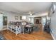 Spacious living room featuring hardwood floors, a cozy fireplace, and comfortable seating at 3718 S County Road 101 E, Clayton, IN 46118