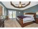 Serene main bedroom with tray ceiling and french doors that lead to outdoor patio at 3718 S County Road 101 E, Clayton, IN 46118