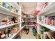 Walk-in pantry with ample shelving, offering plenty of storage for all your groceries and kitchen essentials at 3718 S County Road 101 E, Clayton, IN 46118