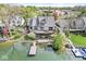 Beautiful lakeside home with a large deck, a hot tub, and a dock at 3748 Bay Rd S Dr, Indianapolis, IN 46240