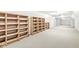 Spacious finished basement with shelving units and ample storage space at 3748 Bay Rd S Dr, Indianapolis, IN 46240
