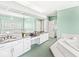 Spacious primary bathroom features dual vanities, garden tub, and ample counter space at 3748 Bay Rd S Dr, Indianapolis, IN 46240