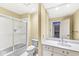 Clean bathroom featuring a shower over tub, white vanity, and a large mirror at 3748 Bay Rd S Dr, Indianapolis, IN 46240
