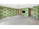 Nicely decorated bedroom with a television and unique banana leaf print wallpaper at 3748 Bay Rd S Dr, Indianapolis, IN 46240